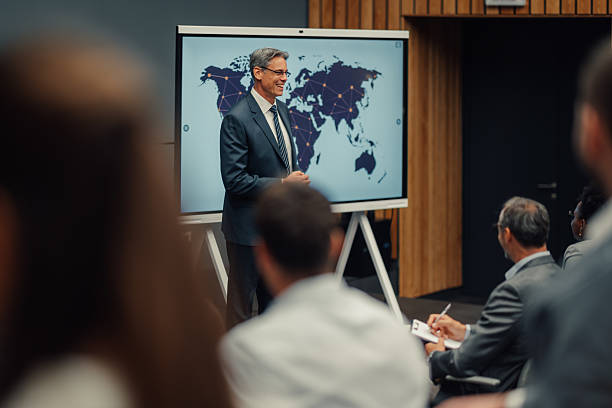istock Businessman giving presentation about global business strategy 2239980443