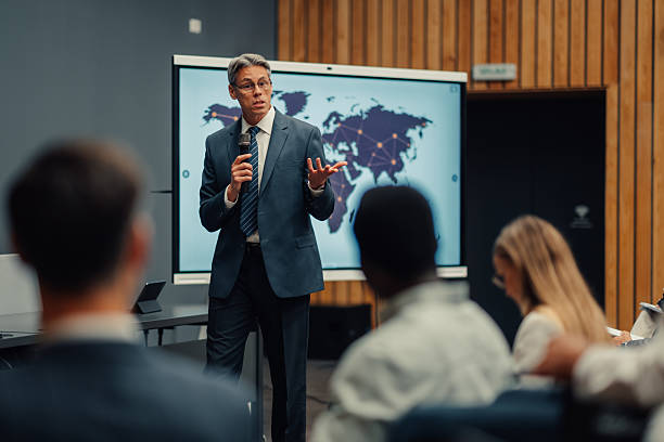 istock Business speaker presenting global strategy at conference 2239980618