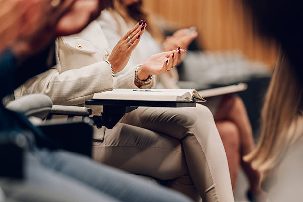 istock Audience member clapping during business conference or seminar 2239980801