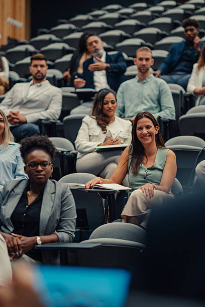 istock Professionals attending a business conference or educational seminar 2239981076
