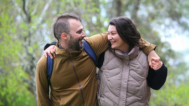 istock Happy   couple walking together outdoors in spring or autumn. 2239984564