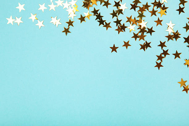 istock Golden glitter stars on blue background 2239986885