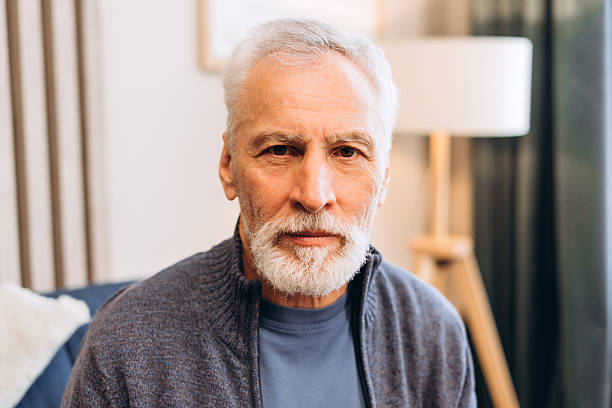 istock Senior man with gray beard looking at camera 2239990618