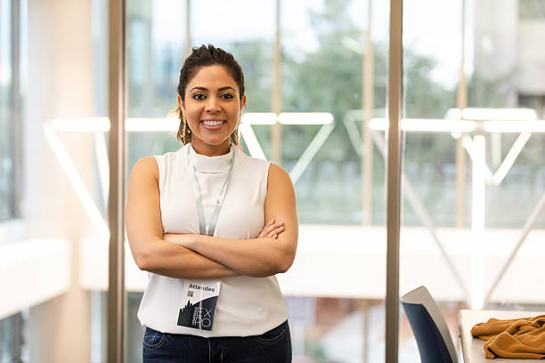 istock Confident attendee with arms crossed, smiling at a conference event 2239995899