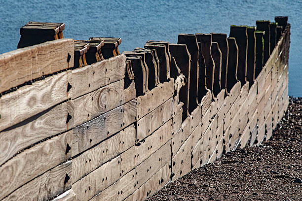 istock Wooden groynes on a beach (series) 4 2239995948