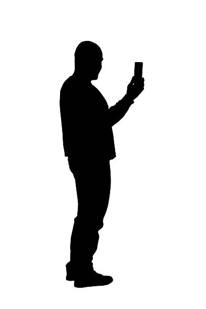 istock side view of a smiling man taking a self-portrait with smartphone on white background 2239996956