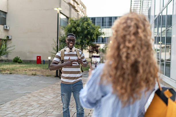 istock Friends taking picture on university campus 2239999554
