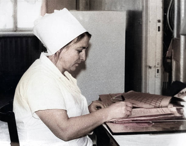 Vintage portrait of a surgical nurse at her workplace. Retro photograph, 1981.