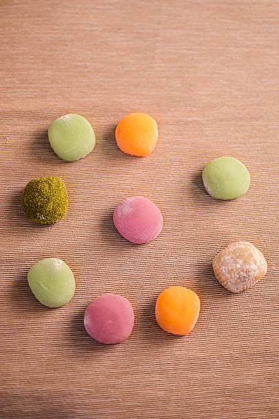 Colorful mochi japanese rice cakes on wood background