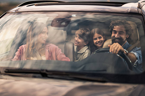 istock Happy family going on a road trip by car. 2240000735