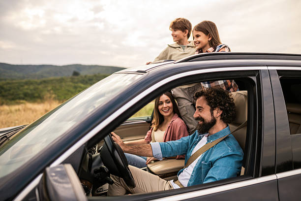 istock Happy family going on a road trip by car. 2240000799