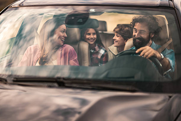 istock Happy family going on a road trip by car. 2240000829