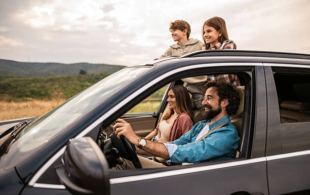 istock Happy family going on a road trip by car. 2240000849