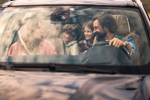 istock Happy family going on a road trip by car. 2240000892