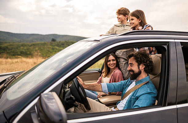 istock Happy family going on a road trip by car. 2240001514