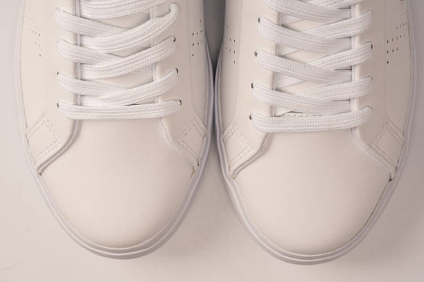 istock White leather sneakers isolated on white background. 2240001620