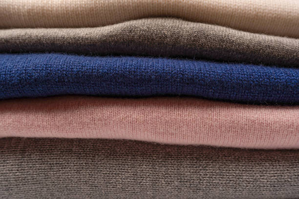 istock A group of warm sweaters isolated on a white background. 2240001641