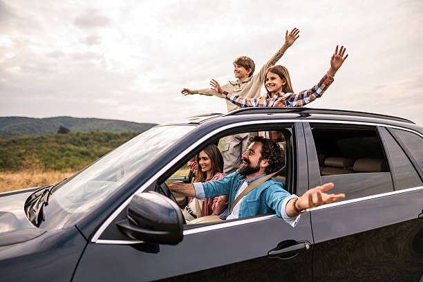 istock Happy family going on a road trip by car. 2240001654