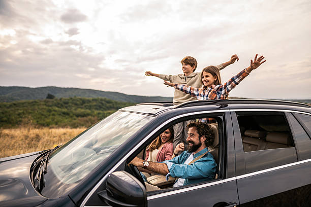 istock Happy family going on a road trip by car. 2240001692