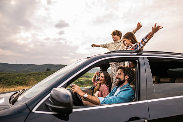 istock Happy family going on a road trip by car. 2240001739