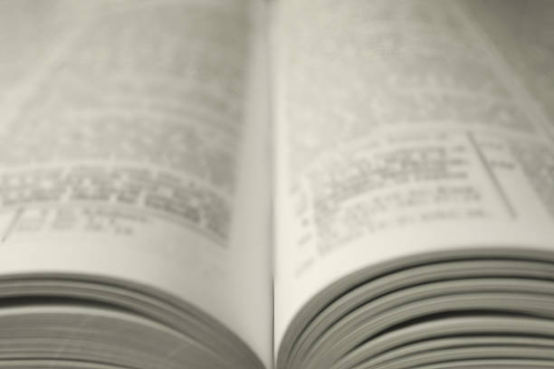 istock Open Holy Bible in English language as background, closeup 2240003123