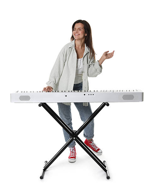 istock Smiling woman playing synthesizer on white background 2240003423