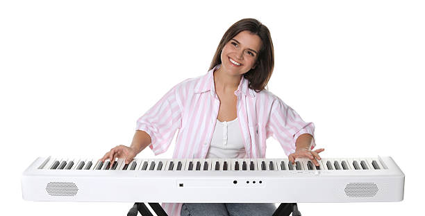 istock Smiling woman playing synthesizer on white background 2240003437