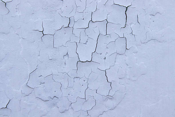 istock Cracked blue oil paint on aged metal surface. Cool grunge crackle texture. Fractured pattern. Peeling paint on Old wall. close up 2240003634