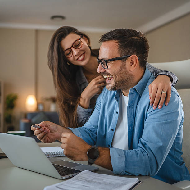 istock Couple planning finances and working from home together 2240005977