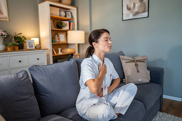 istock Nurse practicing mindfulness meditation for stress relief at home 2240007698