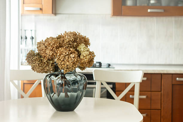 istock Autumn cozy home interior. Beautiful bouquet of dried hydrangeas at kitchen. 2240007827