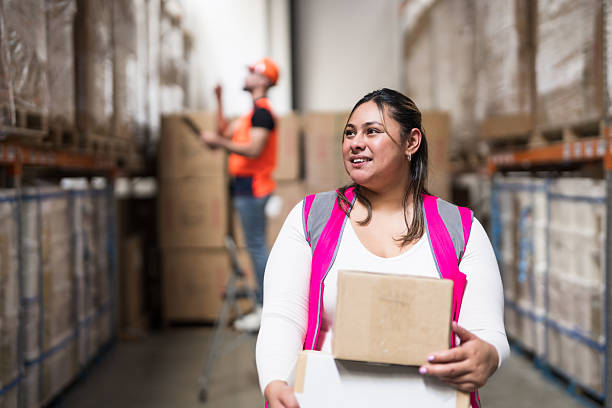 istock Bright smiles behind warehouse productivity. 2240015698