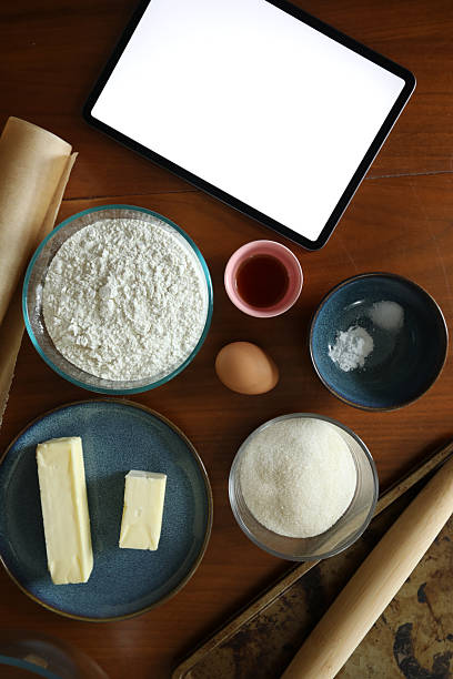 istock Baking ingredients for sugar cookies next to blank digital tablet 2240019794