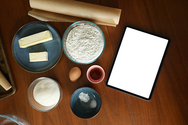 istock Baking ingredients for sugar cookies next to blank digital tablet 2240019805