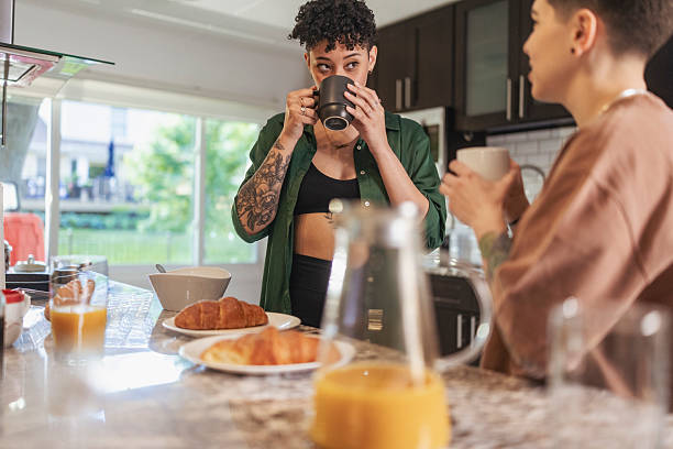 istock Lesbian Couple Enjoying Morning Coffee Together 2240021676