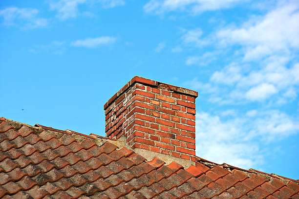 Smoke stacks on the roof of a house