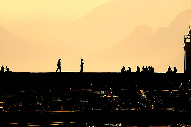 Group of silhouetted people at marina in Antalya, Mediterranean Turkey