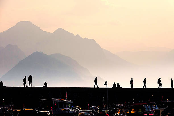 Group of silhouetted people at marina in Antalya, Mediterranean Turkey