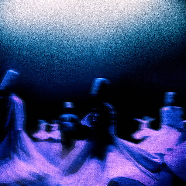 Religious praying event of blurred motion Whirling Sufi Dervishes called ´´Sema´´ in public religious building called ´´Dergah´´ in Konya, Turkey.