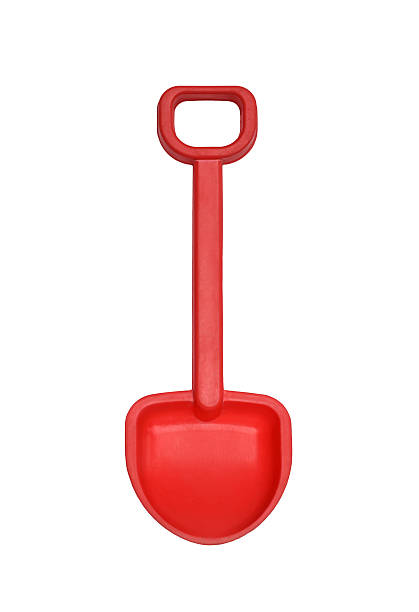 istock Red toy shovel isolated on white 2240033275