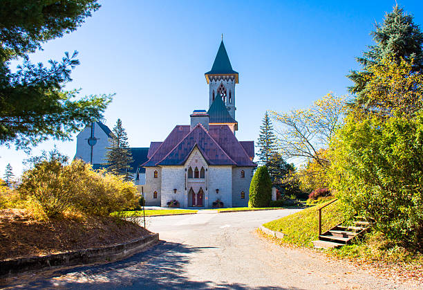 istock Saint Benedict Abbey bordered with fall colors on a clear autumn morning. Clear, blue sky. Quebec, Canada. 2240037266