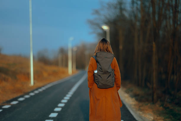 istock Woman Wearing a Backpack on a Walk During Autumn Season 2240038336