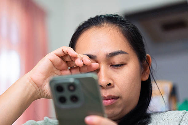 istock Asian Woman Feeling Eye Strain from Using Smartphone 2240039831