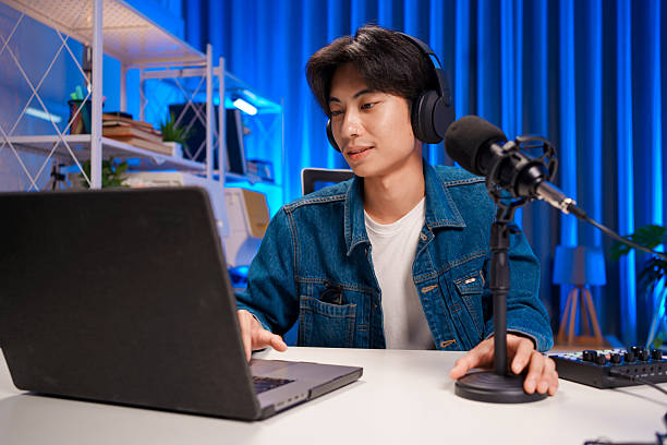istock Young man interacting with audience during podcast 2240040111