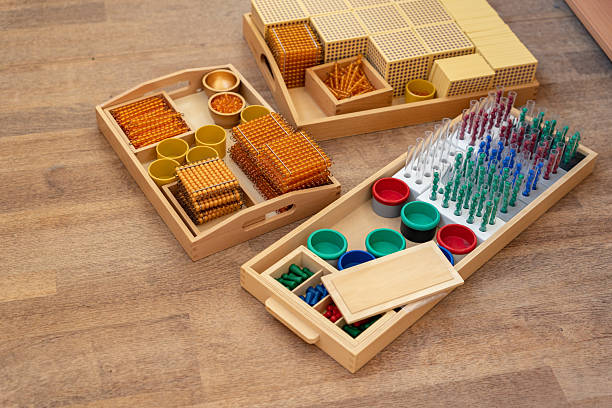 istock Montessori boxes with materials for alternative learning of mathematics, algebra, geometry, arithmetic in arithmetic in elementary or primary school 2240040815