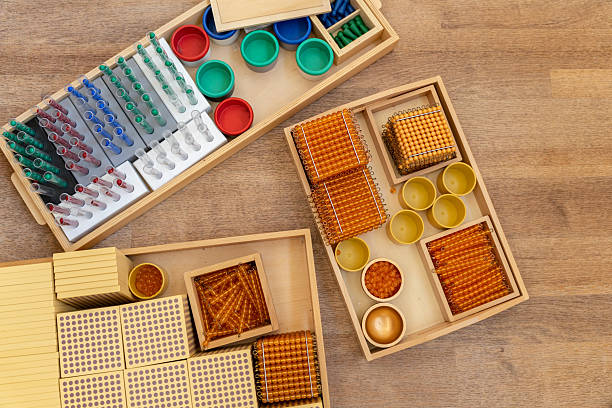 istock Montessori boxes with materials for alternative learning of mathematics, algebra, geometry, arithmetic in elementary school. 2240040816