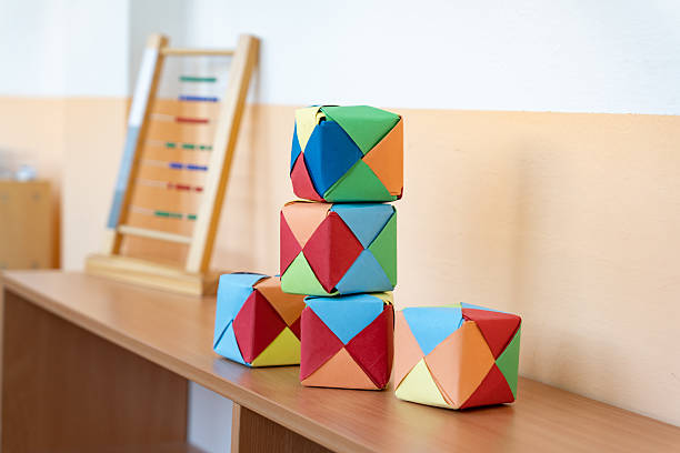 istock Montessori education. Sobone cubes for learning math - geometry by hand. Materials for alternative learning of geometry in primary school. Logical sense, cognitive skills 2240040817
