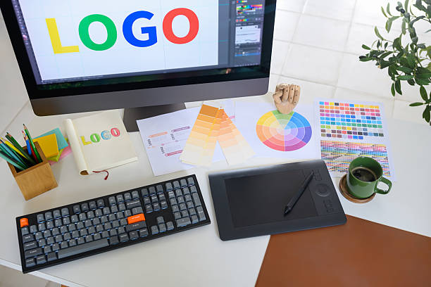 istock Top view of graphic design workstation with branding project in progress 2240044003