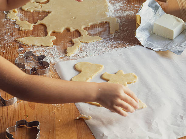 istock girl making Christmas cookies 2240049074