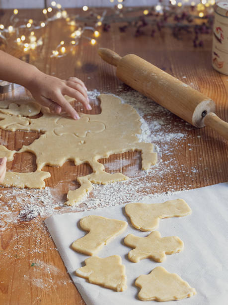 istock girl making Christmas cookies 2240049080